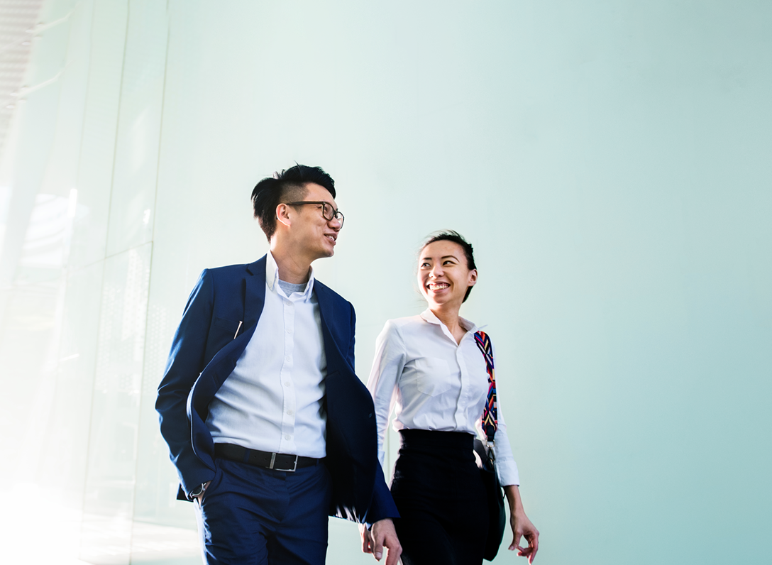 Young professional people walking to work