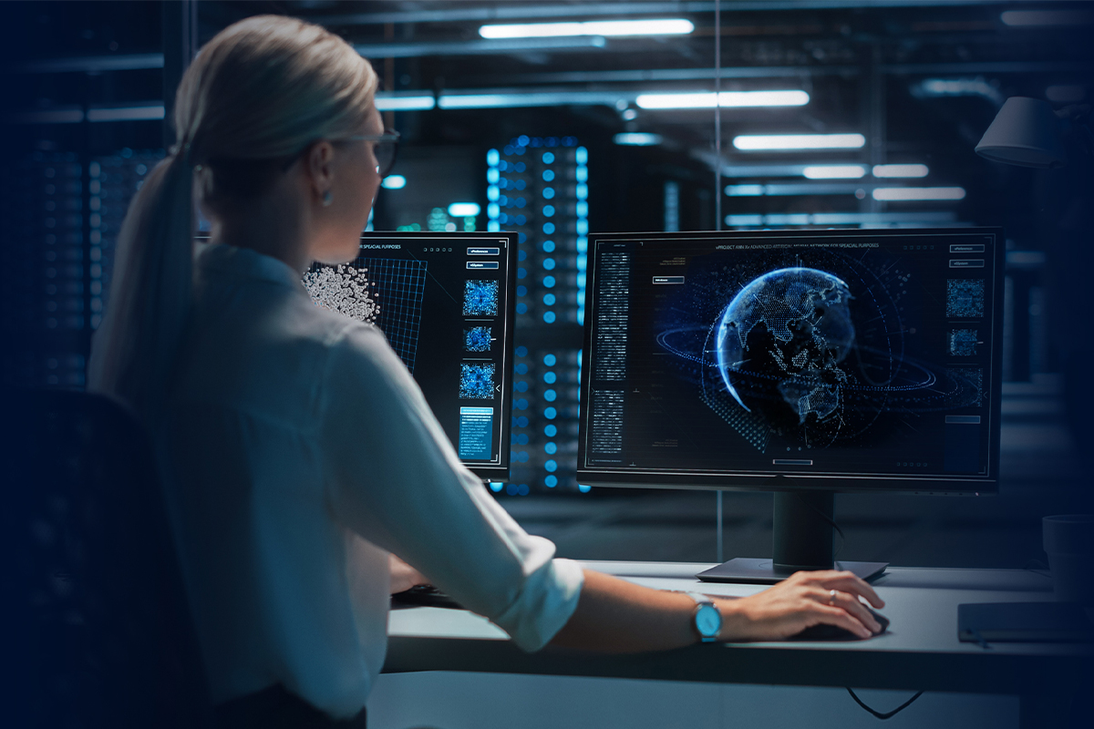 ACIC analyst working on a computer